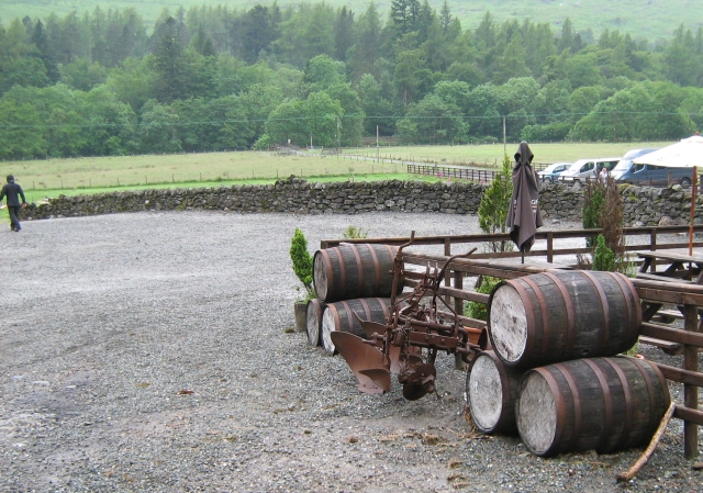 rustic barrels and plough outside the bar at beinglas campsite